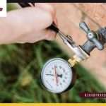 Water pressure gauge attached to outdoor hose bib